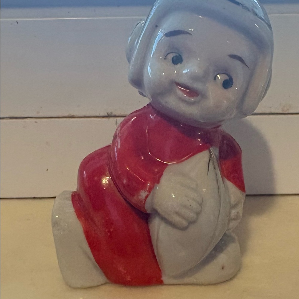 Red and White Ceramic Football figurine.